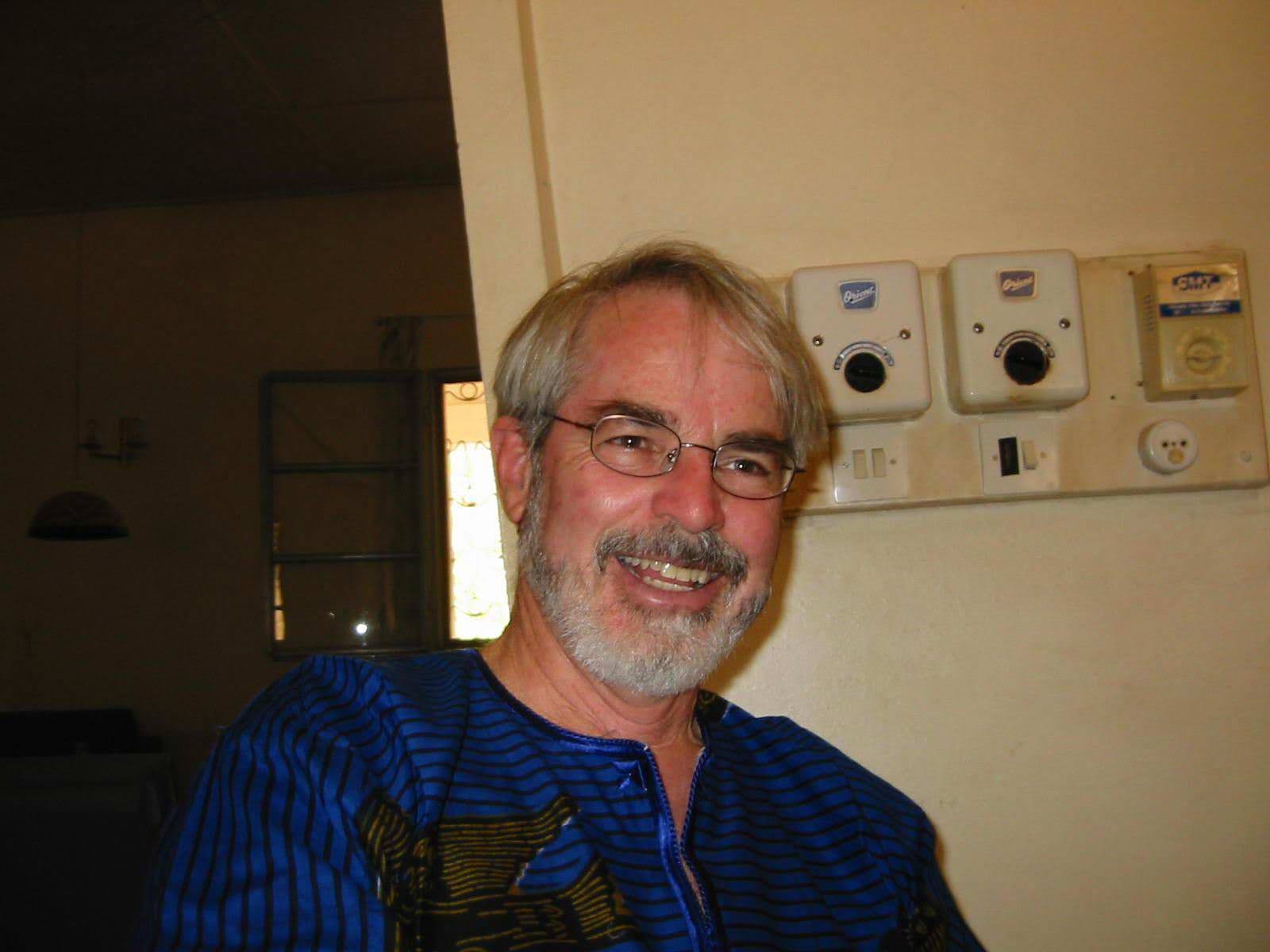 Byron in Africa, blue shirt, smiling